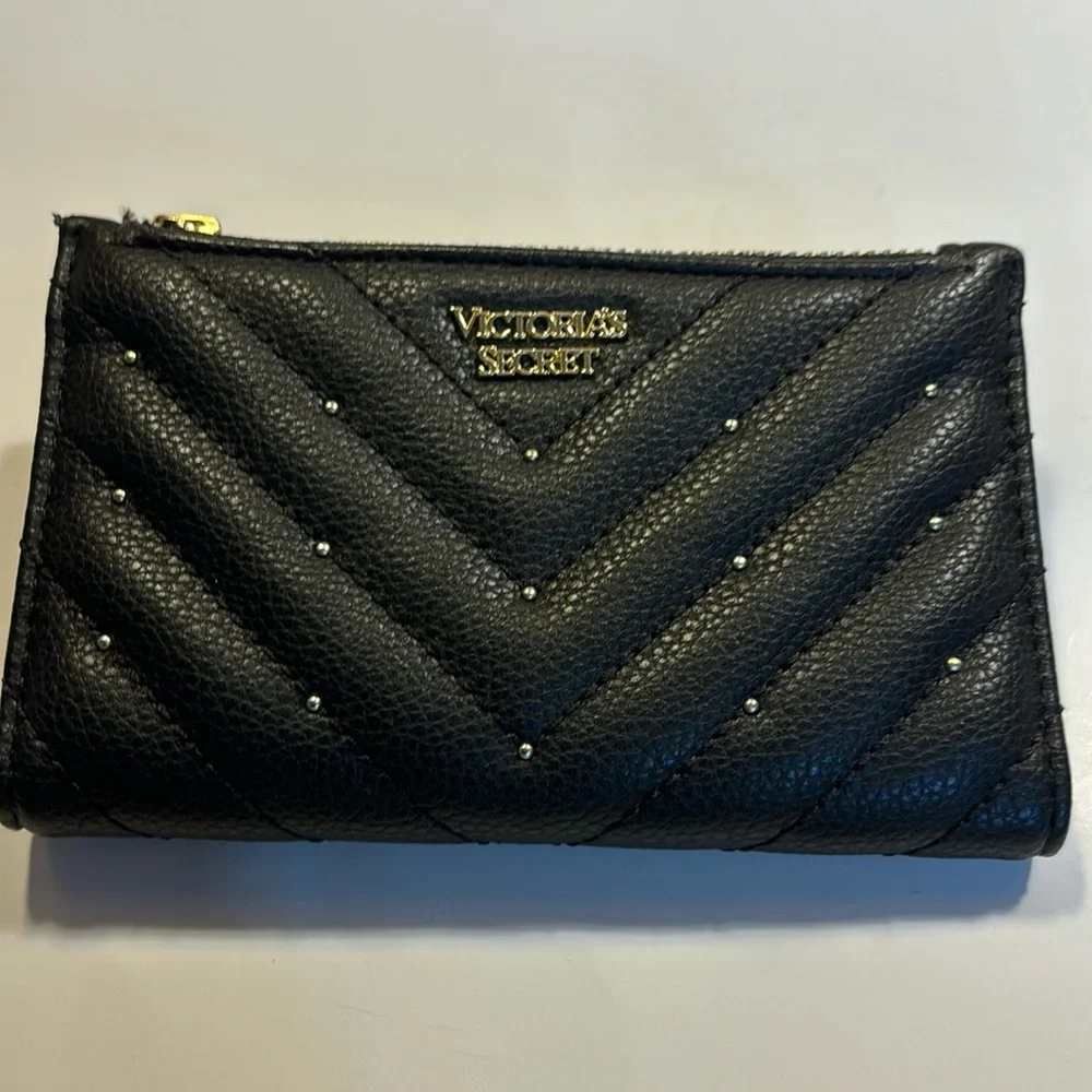 Victoria’s Secret small clutch/wallet black with gold color accents.